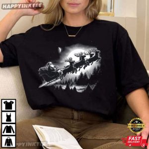 Santa Flying Over Forest in Moonlight Christmas T-Shirt